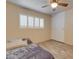 Comfortable bedroom featuring shuttered windows, neutral paint, and wood-look tile flooring for a serene retreat at 8319 E Indianola Ave, Scottsdale, AZ 85251