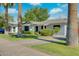 Lovely single-story home with a well-manicured lawn and mature palm trees at 8319 E Indianola Ave, Scottsdale, AZ 85251