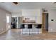 Modern kitchen features stainless steel appliances, a breakfast bar, and an adjacent laundry area at 8319 E Indianola Ave, Scottsdale, AZ 85251