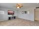 Cozy living room showcasing stylish decor, neutral paint, and wood-look tile flooring, perfect for relaxation at 8319 E Indianola Ave, Scottsdale, AZ 85251
