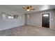 Spacious living room with plenty of room, a front door, decorative mirror, and stylish flooring at 8319 E Indianola Ave, Scottsdale, AZ 85251