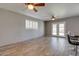 Open living room featuring tile flooring, ceiling fans, and French door access to backyard at 8319 E Indianola Ave, Scottsdale, AZ 85251