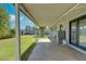 Covered patio area with laundry facilities and views of the expansive backyard at 8319 E Indianola Ave, Scottsdale, AZ 85251