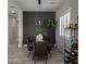Dining room with a large dining table, modern light fixture, and stylish accent wall at 851 E Deer Creek Rd, Phoenix, AZ 85048