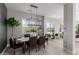 Open concept dining room with a modern light fixture and hardwood flooring at 851 E Deer Creek Rd, Phoenix, AZ 85048