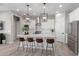 Modern kitchen featuring an island, stainless steel appliances, and custom cabinets at 851 E Deer Creek Rd, Phoenix, AZ 85048