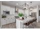 Modern kitchen featuring an island, stainless steel appliances, and custom cabinets at 851 E Deer Creek Rd, Phoenix, AZ 85048