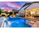 Beautiful backyard oasis featuring a sparkling pool and seamless indoor/outdoor lifestyle at 851 E Deer Creek Rd, Phoenix, AZ 85048