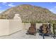Relaxing balcony with lounge chairs and a table, offering stunning views of the natural landscape at 10040 E Happy Valley Rd # 479, Scottsdale, AZ 85255