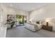 Spacious bedroom with neutral colors, carpet, and a sliding door offering a view of the backyard at 10040 E Happy Valley Rd # 479, Scottsdale, AZ 85255