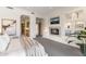 Inviting bedroom with fireplace, television, and a glimpse into the ensuite bathroom at 10040 E Happy Valley Rd # 479, Scottsdale, AZ 85255