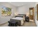 Well lit bedroom with large picture window and gray accents at 10040 E Happy Valley Rd # 479, Scottsdale, AZ 85255