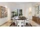 Inviting dining room with unique furnishings, large windows, and a built-in cabinet for storage at 10040 E Happy Valley Rd # 479, Scottsdale, AZ 85255