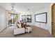 Comfortable living room with media screen and sliding door access to an outdoor living space at 10040 E Happy Valley Rd # 479, Scottsdale, AZ 85255