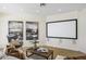 Bright living room with media screen, modern decor and comfortable seating at 10040 E Happy Valley Rd # 479, Scottsdale, AZ 85255