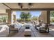 Outdoor patio featuring desert landscaping, an outdoor fireplace, and view of the swimming pool at 10040 E Happy Valley Rd # 479, Scottsdale, AZ 85255