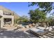 Backyard pool area with mountain views, desert landscaping, and comfortable lounge chairs at 10040 E Happy Valley Rd # 479, Scottsdale, AZ 85255