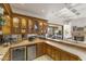 Stylish wet bar featuring custom cabinetry and convenient access to the living room and outdoor spaces at 10040 E Happy Valley Rd # 479, Scottsdale, AZ 85255