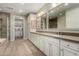 Elegant bathroom with double sink vanity, modern fixtures, and large mirrors at 10260 E White Feather Ln # 1022, Scottsdale, AZ 85262