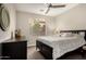 Comfortable bedroom with a window, dark wood furniture, and neutral walls at 10260 E White Feather Ln # 1022, Scottsdale, AZ 85262