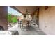 Large covered patio boasts outdoor dining, ceiling fans, and tranquil landscaping at 10260 E White Feather Ln # 1022, Scottsdale, AZ 85262