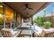 Expansive covered patio with ceiling fans, comfortable seating, and serene desert landscaping at 10260 E White Feather Ln # 1022, Scottsdale, AZ 85262