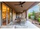 Spacious covered patio with ceiling fans and a large dining table perfect for outdoor entertaining at 10260 E White Feather Ln # 1022, Scottsdale, AZ 85262