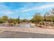 Desert landscaping and signage mark the entrance to The Ridge at Troon North in Scottsdale, Arizona at 10260 E White Feather Ln # 1022, Scottsdale, AZ 85262