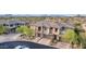 Exterior elevation of multi-Gathering home with two-car garages and desert landscaping at 10260 E White Feather Ln # 1022, Scottsdale, AZ 85262