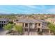 Exterior elevation of multi-Gathering home with desert landscaping and mountain views at 10260 E White Feather Ln # 1022, Scottsdale, AZ 85262