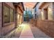 Exterior view showing a well-maintained walkway between two modern residential buildings at 10260 E White Feather Ln # 1022, Scottsdale, AZ 85262