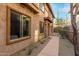 Exterior view of a home with stone accents, desert landscaping and neutral color scheme at 10260 E White Feather Ln # 1022, Scottsdale, AZ 85262