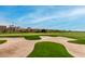 Sand trap on the green fairway of the Troon North Golf Club, a luxurious amenity for the community at 10260 E White Feather Ln # 1022, Scottsdale, AZ 85262