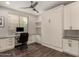 Bright home office with built-in desk, cabinets, and a murphy bed for flexible living at 10260 E White Feather Ln # 1022, Scottsdale, AZ 85262