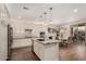 Bright kitchen features a large island, stainless steel appliances, and adjacent dining area at 10260 E White Feather Ln # 1022, Scottsdale, AZ 85262