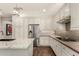 Bright kitchen features modern cabinetry, granite countertops, and stainless steel refrigerator at 10260 E White Feather Ln # 1022, Scottsdale, AZ 85262