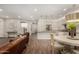 Open-concept living room flowing into the kitchen, featuring hardwood floors and modern decor at 10260 E White Feather Ln # 1022, Scottsdale, AZ 85262