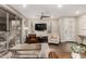 Comfortable living room features wood floors, neutral tones, and a sliding glass door that leads to the patio at 10260 E White Feather Ln # 1022, Scottsdale, AZ 85262
