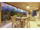Inviting outdoor dining area with desert views, fireplace, TV, and comfortable seating for relaxation at 10260 E White Feather Ln # 1022, Scottsdale, AZ 85262