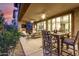 Expansive covered patio with multiple seating and dining areas, offering stunning desert views at 10260 E White Feather Ln # 1022, Scottsdale, AZ 85262