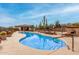 Community pool with lounge chairs and landscaped surroundings, offering a resort-style experience at 10260 E White Feather Ln # 1022, Scottsdale, AZ 85262