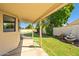 Charming covered patio with a fountain and lush backyard at 10837 W Cottonwood Ln, Avondale, AZ 85392