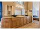 Bathroom boasts a double vanity with modern vessel sinks and granite countertops at 10837 W Cottonwood Ln, Avondale, AZ 85392
