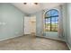Large bedroom with a ceiling fan, carpet, and walk-in closet at 10837 W Cottonwood Ln, Avondale, AZ 85392