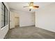 Light bedroom with a ceiling fan, carpet, and a walk-in closet at 10837 W Cottonwood Ln, Avondale, AZ 85392