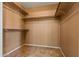 Walk-in closet offers ample storage space with built-in shelving and rods at 10837 W Cottonwood Ln, Avondale, AZ 85392