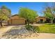 A charming single-story home with a two-car garage and well-maintained lawn at 10837 W Cottonwood Ln, Avondale, AZ 85392