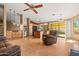 Spacious living area featuring hardwood floors and an open layout connecting to the kitchen at 10837 W Cottonwood Ln, Avondale, AZ 85392