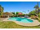 Relaxing backyard pool and spa area with lounge chairs and mature landscaping at 10837 W Cottonwood Ln, Avondale, AZ 85392