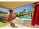Backyard features a refreshing pool, lounge seating, and a relaxing hot tub at 10837 W Cottonwood Ln, Avondale, AZ 85392